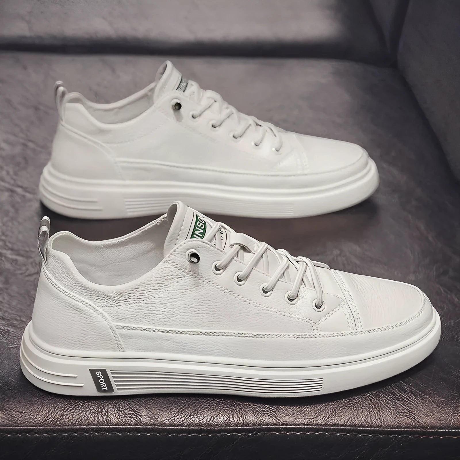 Men's casual white flat shoes with round toe and shallow mouth design on a plain background