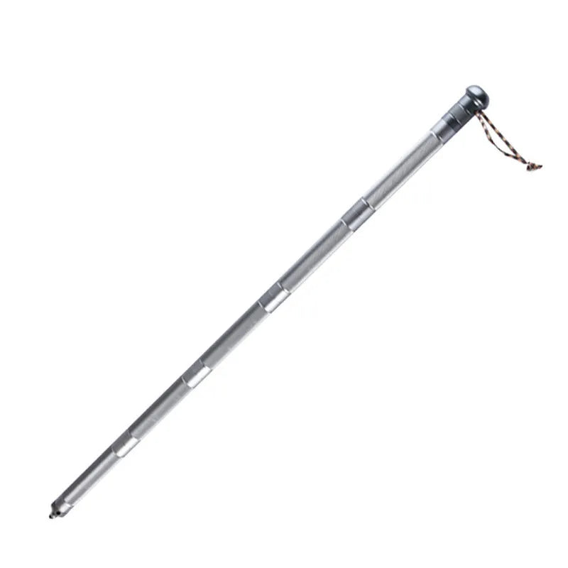 Silver folding aluminium alloy trekking pole 95cm fully extended on outdoor trail ground