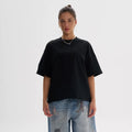 Tall loose fit pure cotton t-shirt in apricot colour on a hanger, showing short sleeves and casual style.
