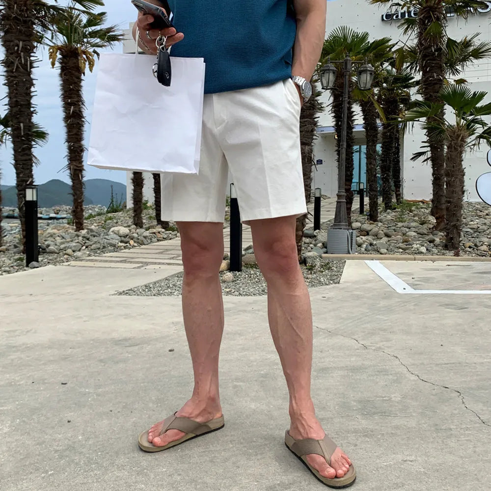 Men's straight-leg casual shorts in solid black, white, or khaki colour made from polyester fabric.