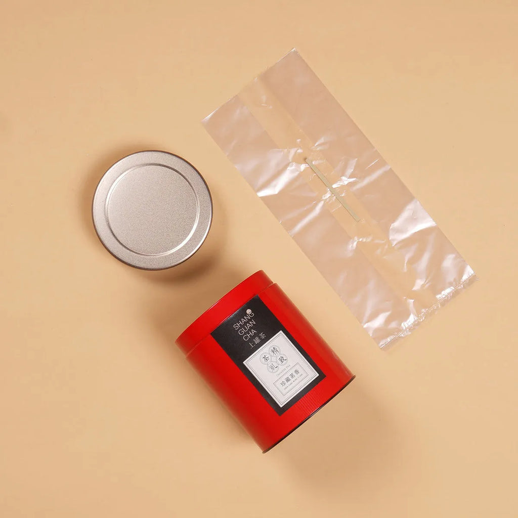 Green tinplate tea packing box with sealed lid, 150ml capacity for loose leaf tea storage.
