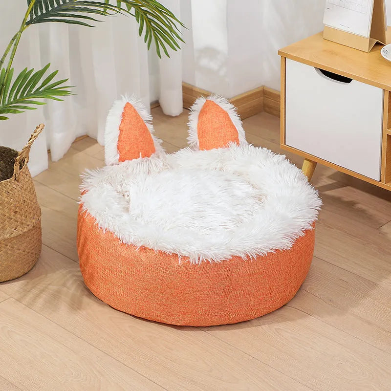 Round plush faux fur cat bed with raised sides in blue colour showing soft texture