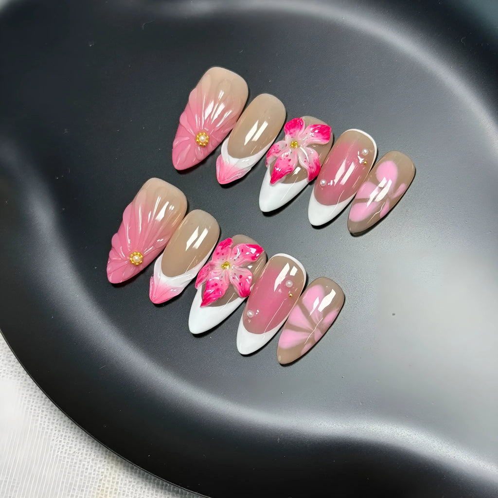 3D French style lily and ice flower plastic nail decoration in almond shape on a nail.