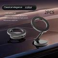 All-metal magnetic car phone mount with foldable arm in Qian colour on a car dashboard.