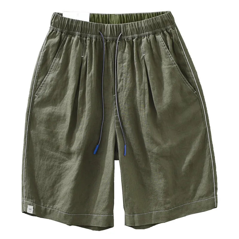 Men's loose fit linen shorts in green on a hanger, showing straight leg and drawstring waist.