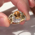 Gold-colour copper women's ring with embossed feather design and yellow zircon stone.