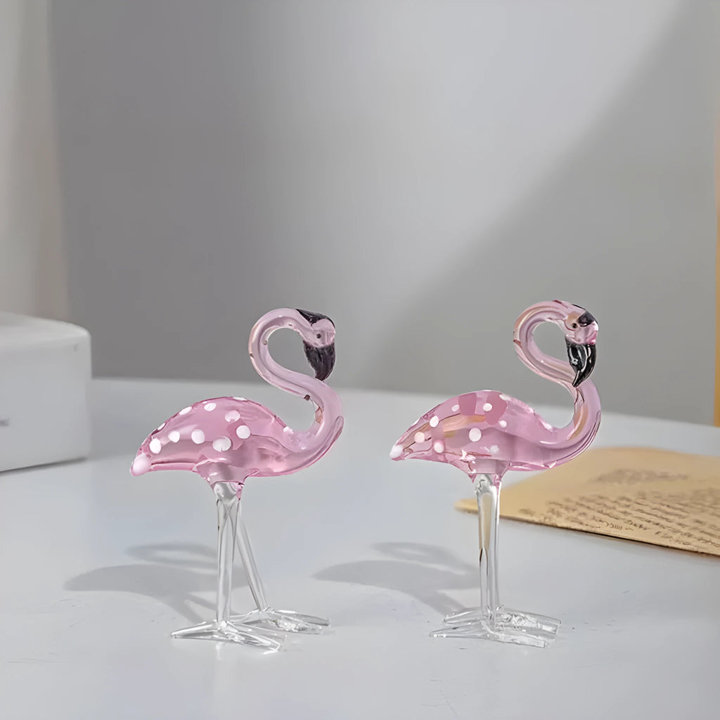 Pink crystal flamingo decorative ornament on a table for modern home decor.