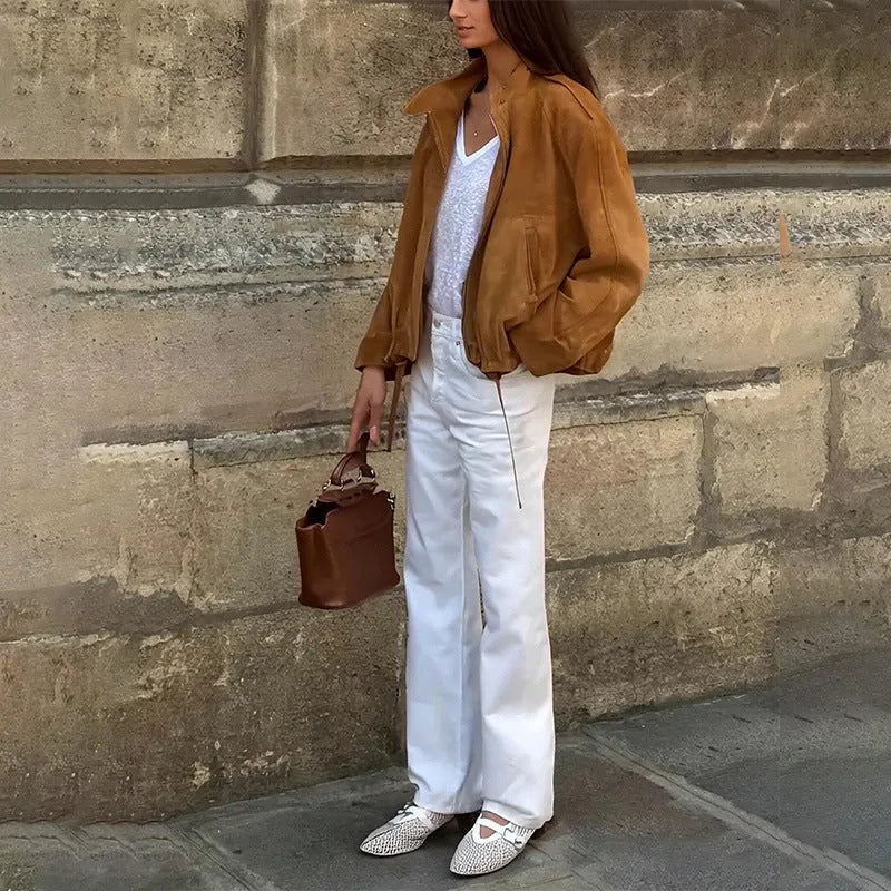 Man wearing a solid colour retro loose-fit polyester jacket with long sleeves.