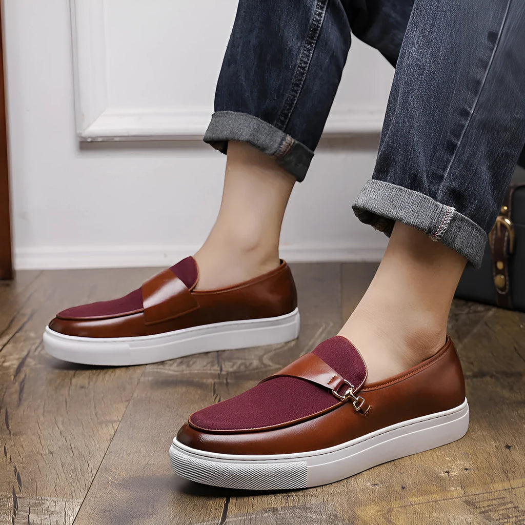 Men's black slip-on shoes with gold horsebit buckle and round toe stitching design
