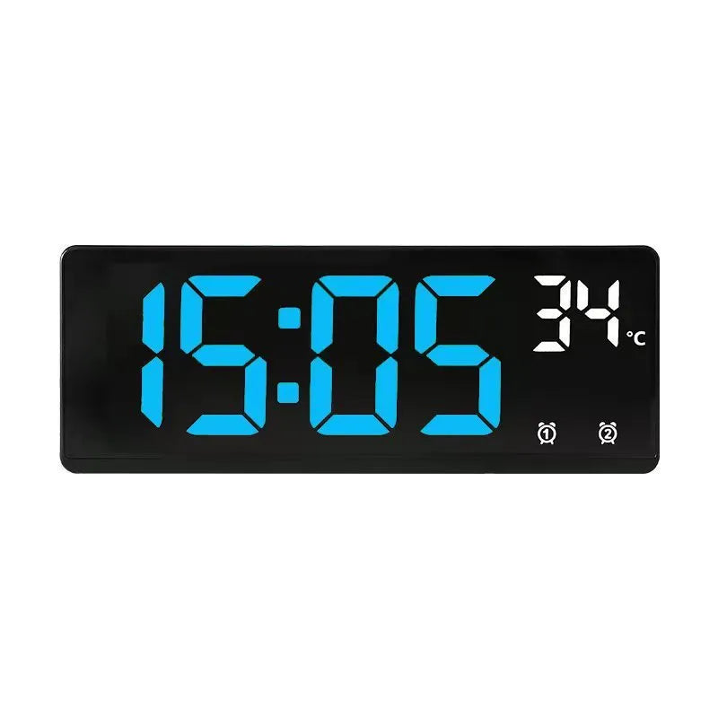 Large screen electronic LED alarm clock showing time and temperature, in a black acrylic casing.
