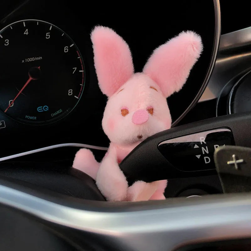 Cute cotton car decoration doll showing a pilot dog design on a dashboard.