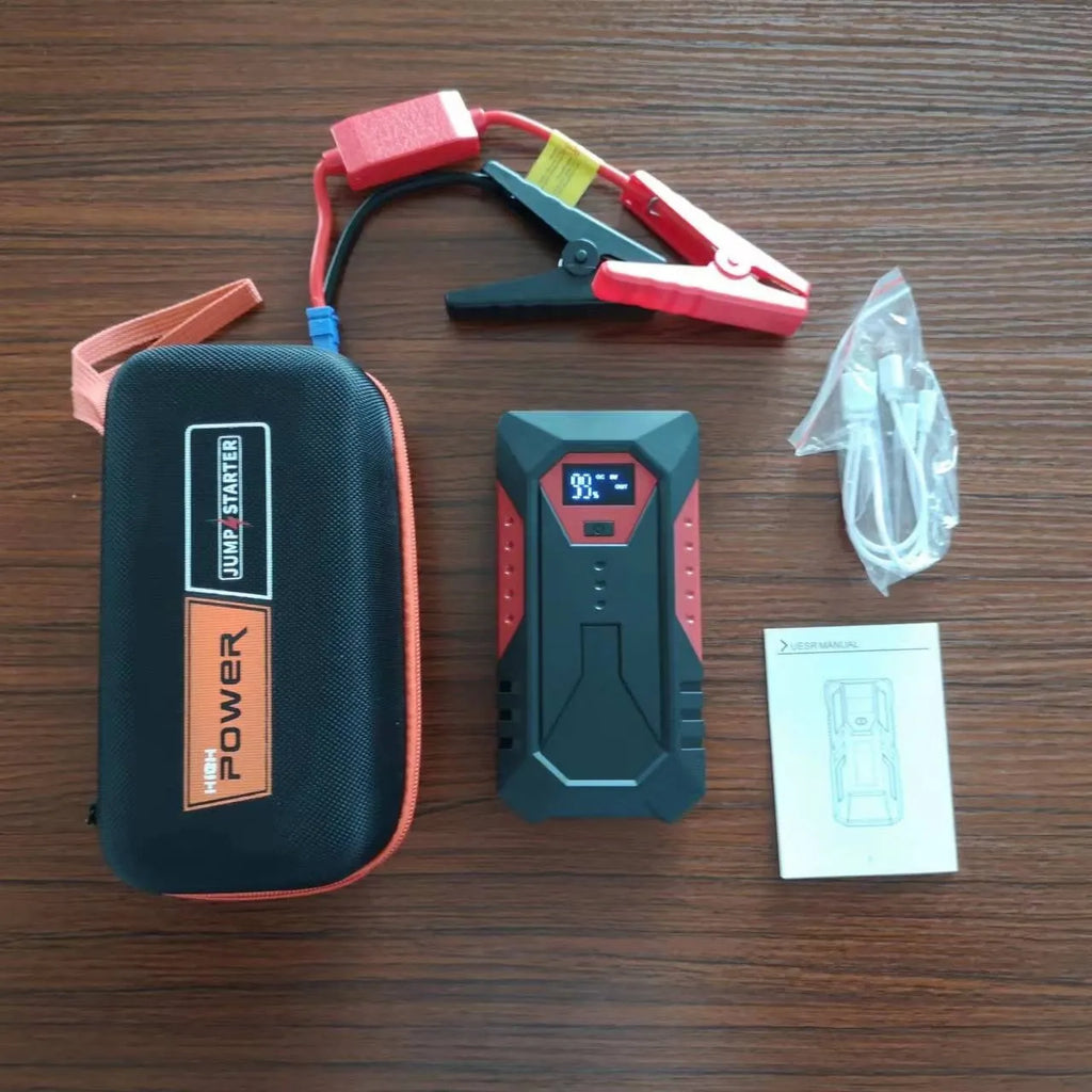 Red 12V car battery jump starter emergency power bank with battery clamps and cable
