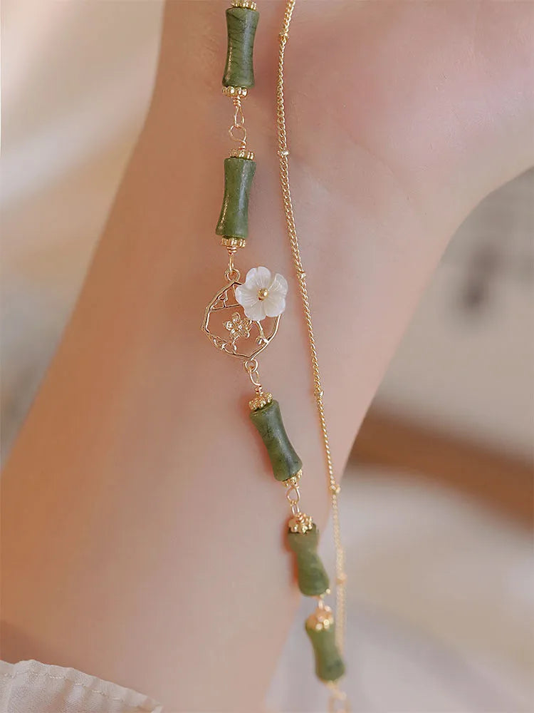 Natural olivine double layer bracelet with twin bells of Ireland charms and olive branch elements