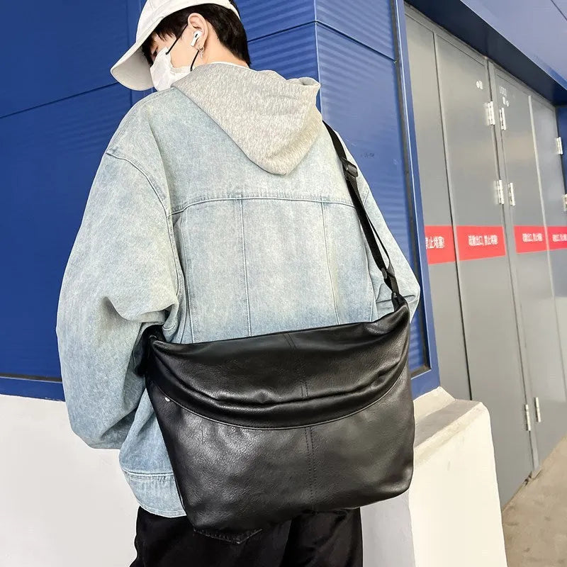 Brown men's retro-style crossbody bag made of PU leather with large capacity.