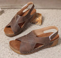 Women's brown Roman platform sandals with a skirt detail and velcro strap on a 1cm rubber sole.