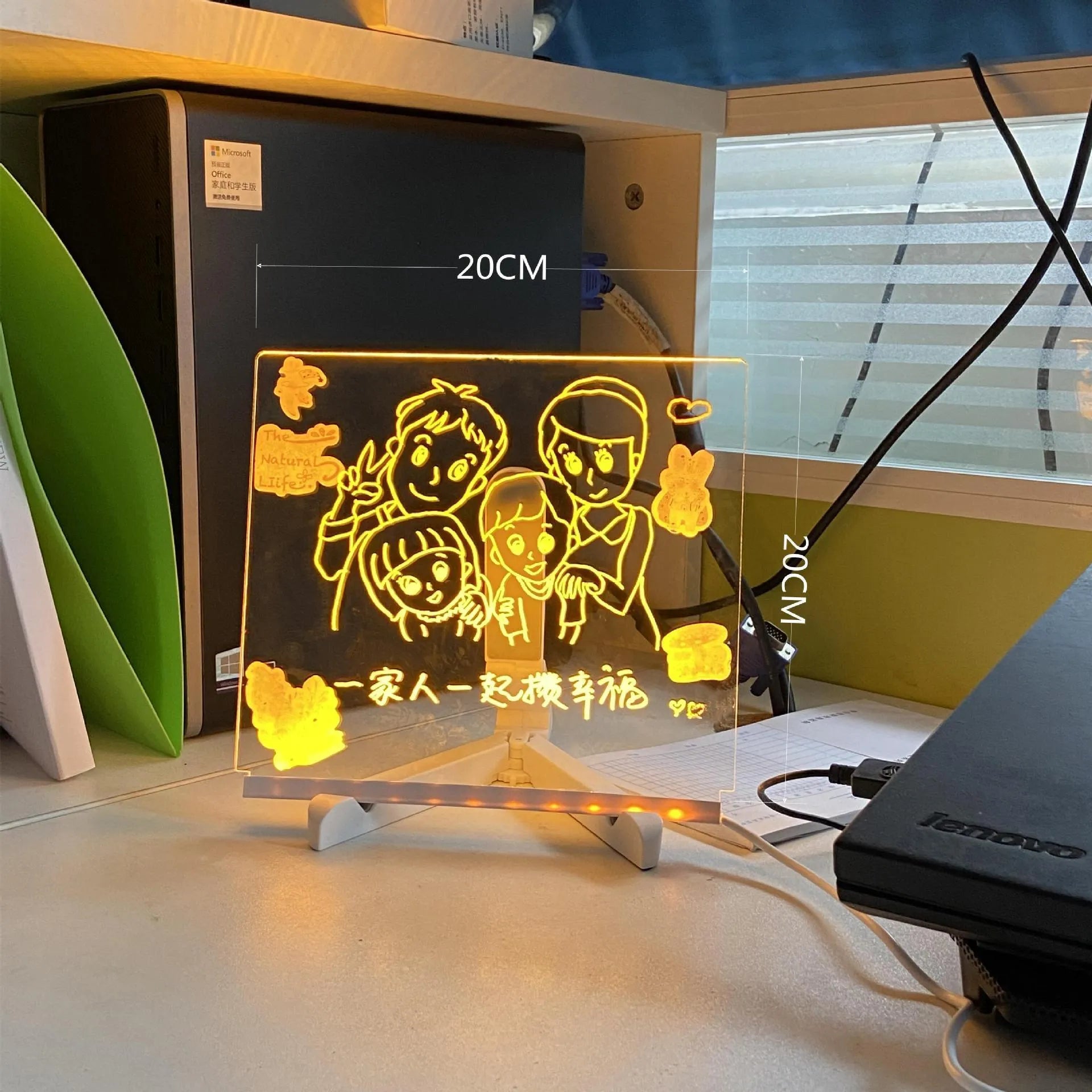 Acrylic DIY LED message board on a bracket, glowing softly with handwritten notes, alongside white and colourful pens.