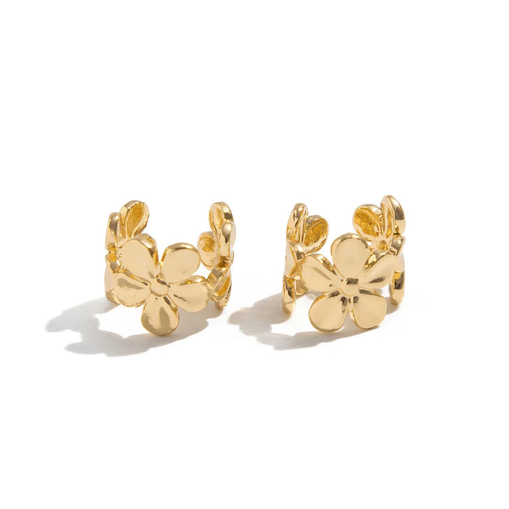 Gold-coloured starfish and scallop shell women's alloy earrings on a white background.