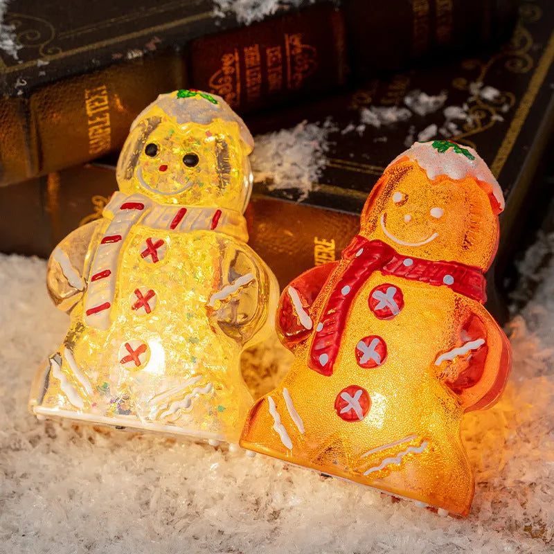 Glowing LED Christmas ornament of a gingerbread man with a red scarf.