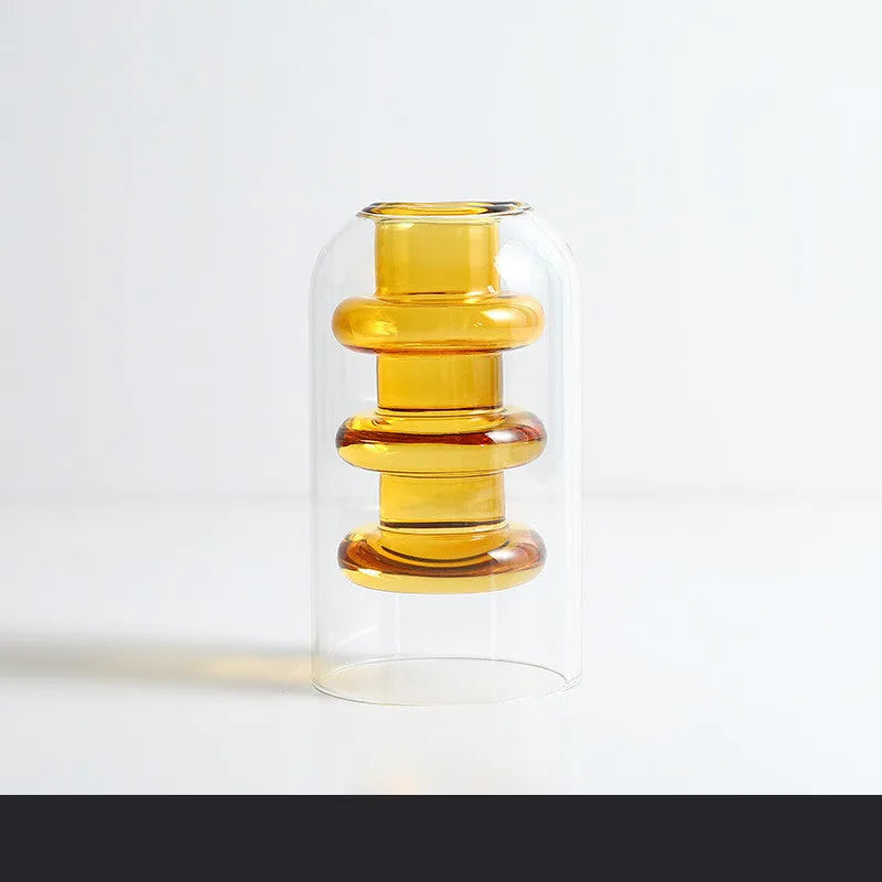 Small colourful double layer blown glass vase for dried flowers, yellow colour option on a table
