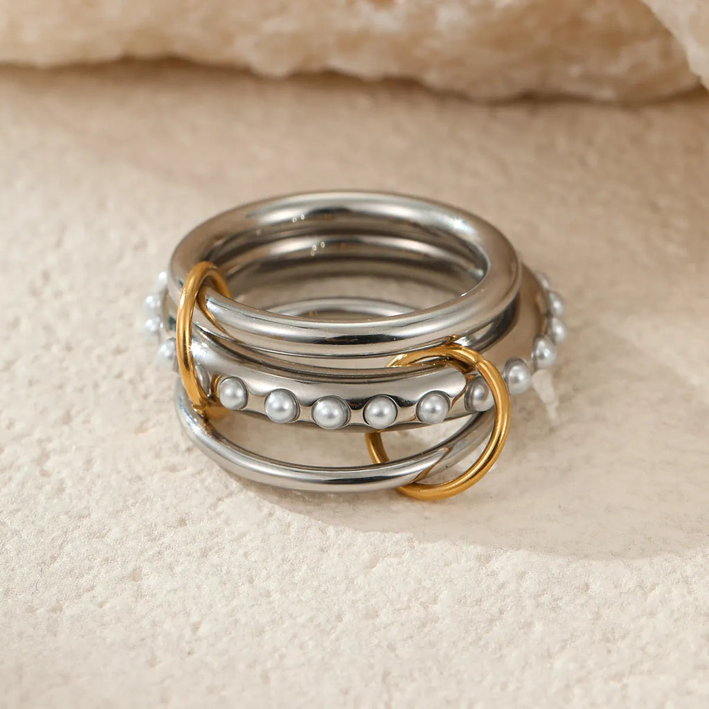 A stacked stainless steel ring set with 18K gold plating in an exaggerated design for women.