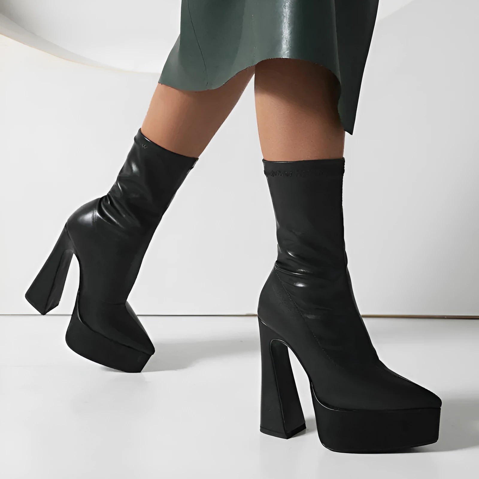 Women's black platform booties with thick super high heel and short stout heel
