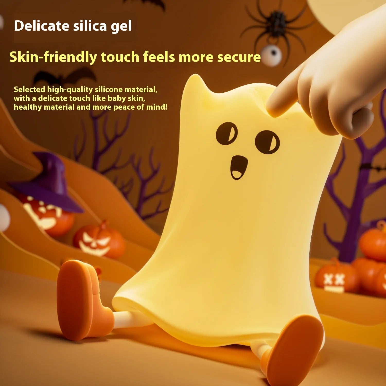 Ghost shaped silicone bedside lamp with touch control emitting soft yellow glow on a bedside table