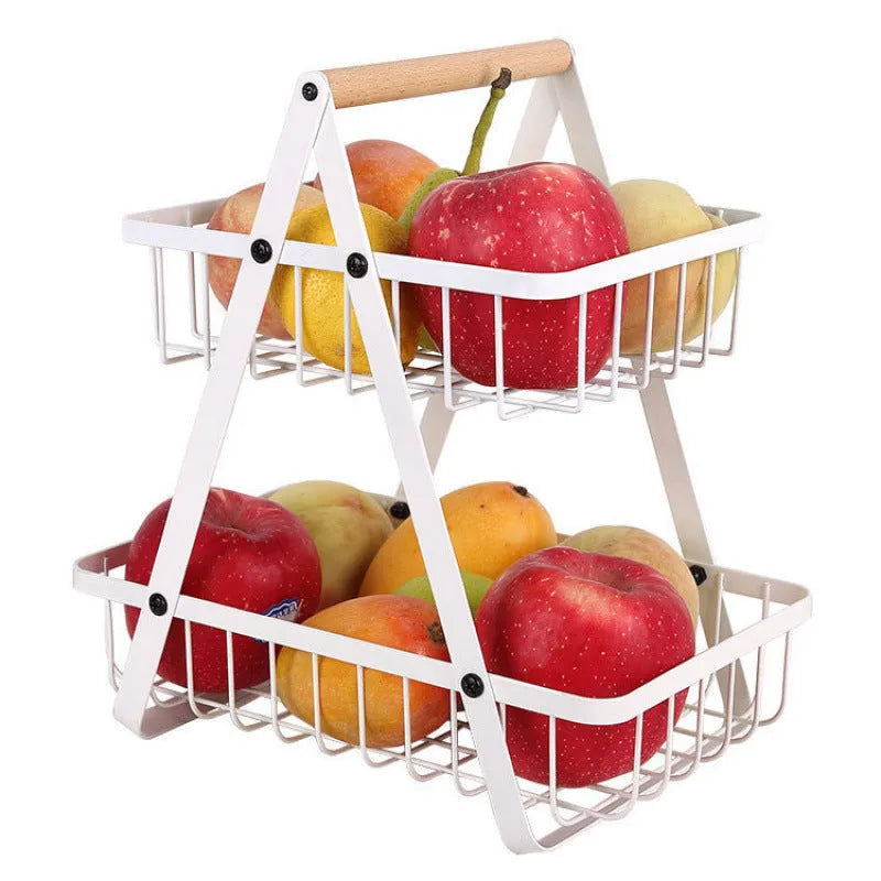 Black detachable iron double-layer fruit basket with a wooden carry handle on a tabletop.