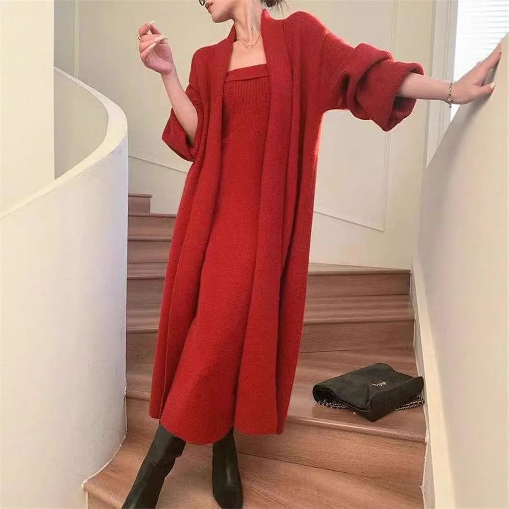 Women's grey knitted long sleeve cardigan and dress co-ord set with flocking detail on a hanger.