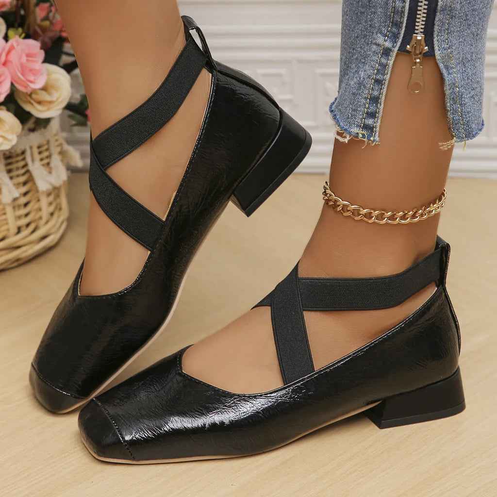 Gold slip-on evening pumps with a square toe and low heel on a plain background.