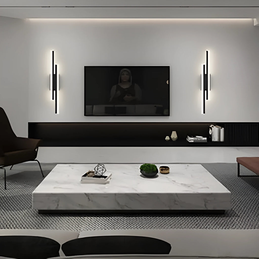 Scandinavian minimalist acrylic LED wall light in black or gold finish on a modern interior wall.