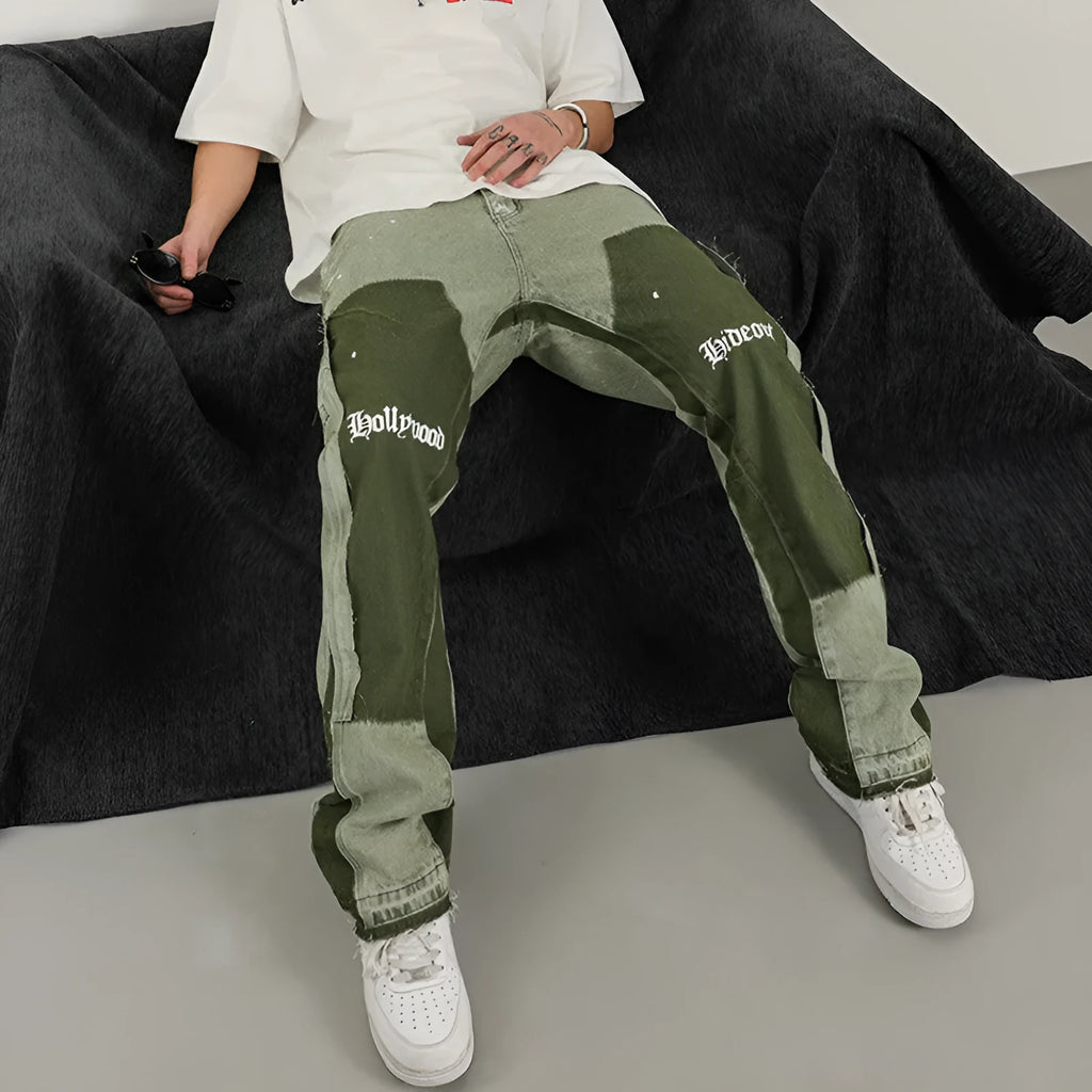 Men's heavy wash flared denim trousers in black green with multi-pocket and raw edge detailing