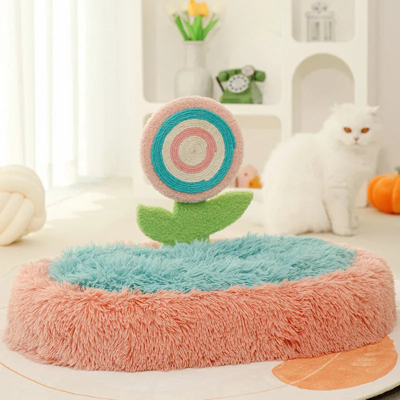 Pink thick plush elliptical cat bed with a deep, lollipop-shaped nest for cats.