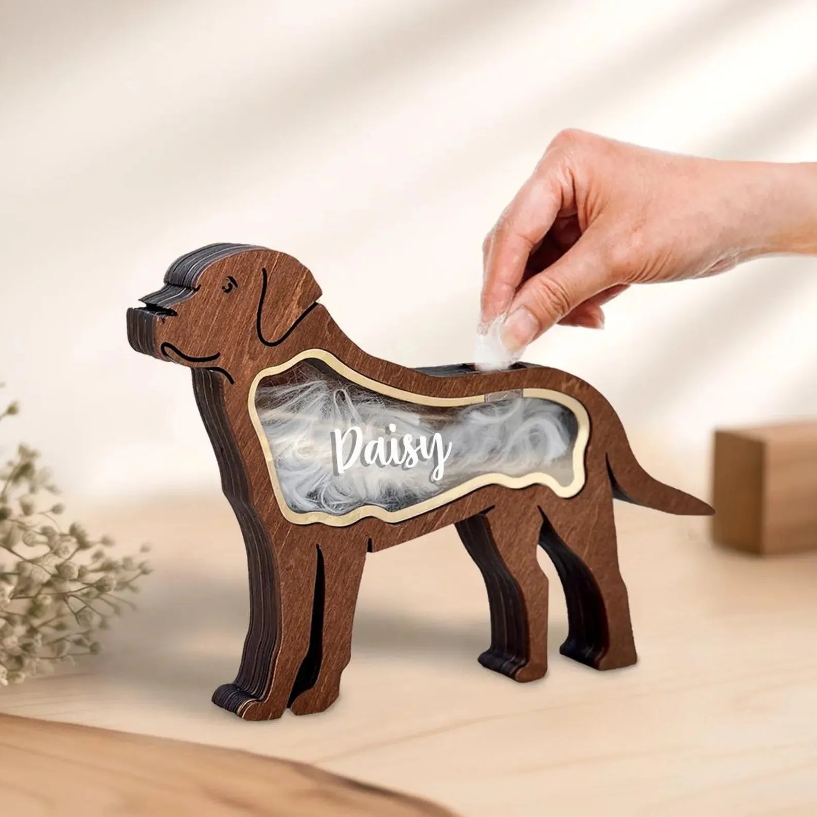 Black wooden pet hair storage box with compartments for grooming brushes and combs