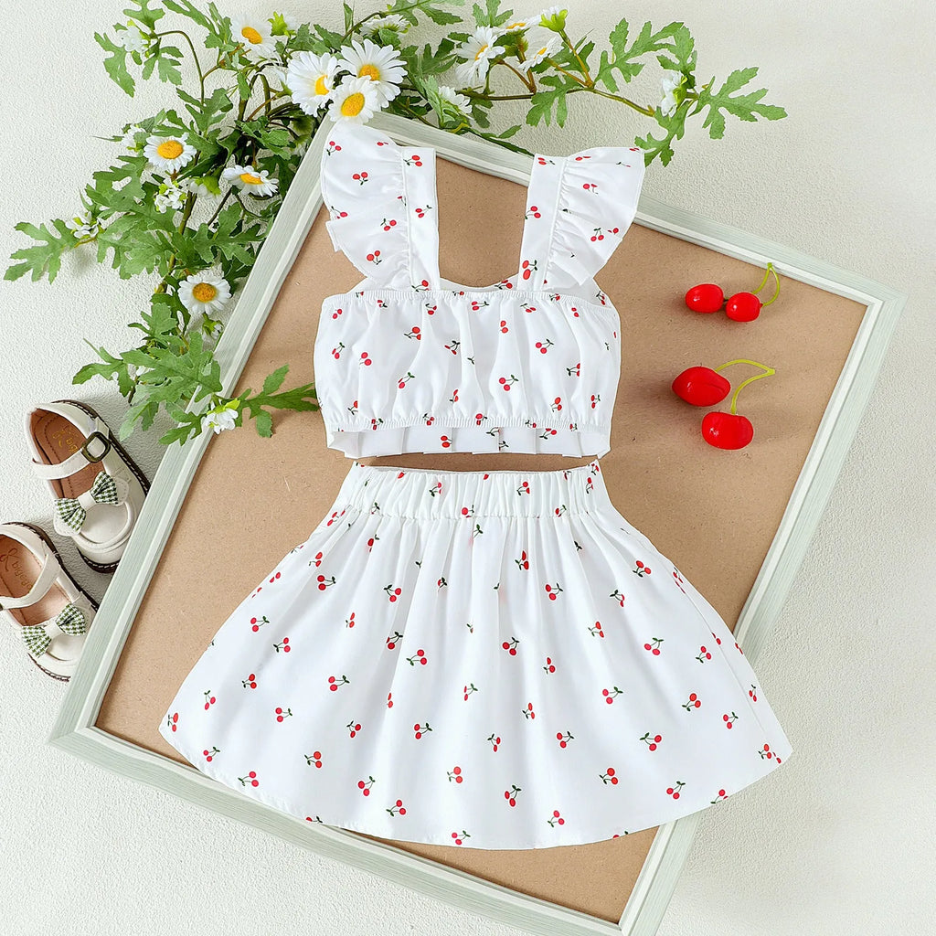 Girls' cotton two-piece skirt set with long-sleeve flounced top, bow, and pleated skirt in green or white