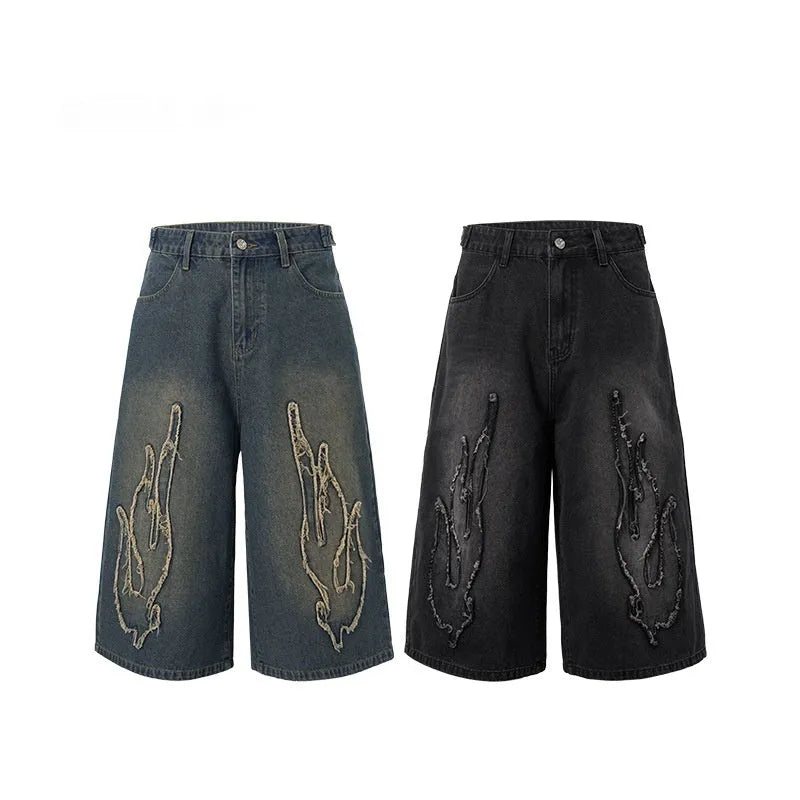 Men's black denim shorts with cropped patch flame embroidery detail, straight leg cut
