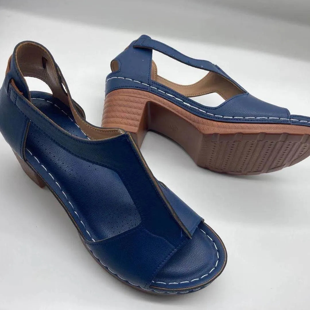 Women's low heel peep toe wedge sandals with a Roman style buckle strap in light brown.