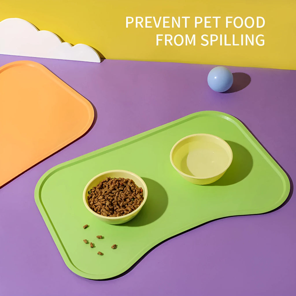 Waterproof silicone dog food mat with raised edges in green colour, non-slip base for pet bowls