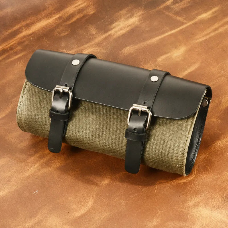 Camel Bag Knight cotton messenger bag in army green with rivet details, showing internal zipper and phone pockets.