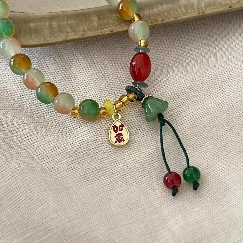 M990 Lotus Ruyi bracelet showing mixed material construction and lotus motif with manual craft details