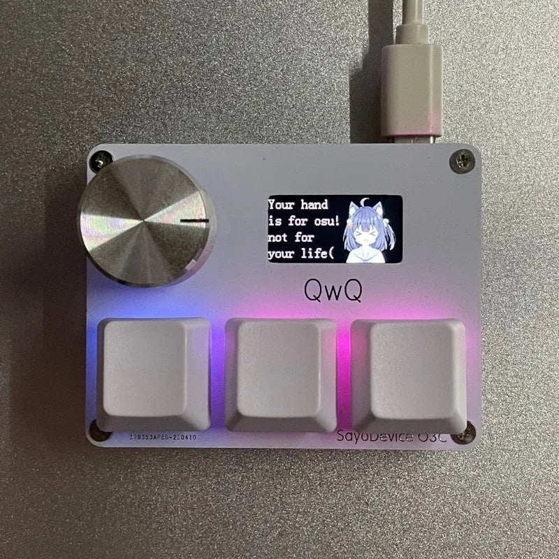 Customisable magnetic axis numeric keyboard with programmable knob and colour screen in black, pink, silver, or white.