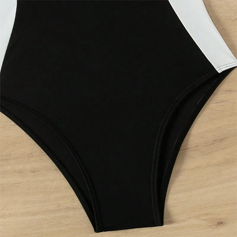 Women's black and white one-piece swimsuit with pearl spaghetti straps, slim-fitting nylon swimwear