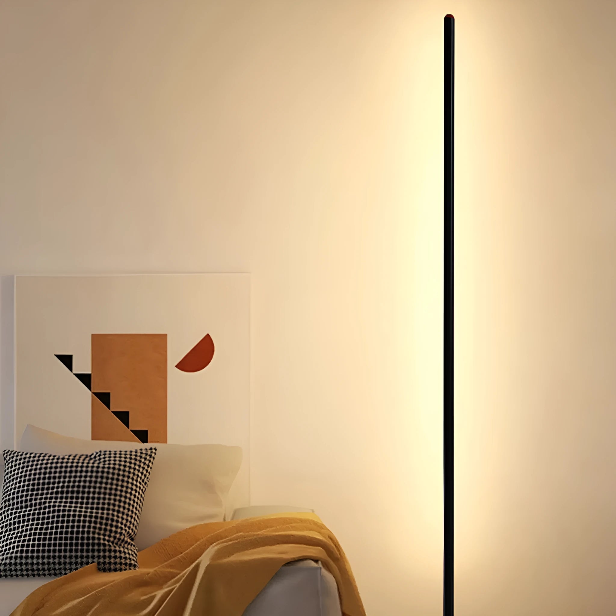 Vertical aluminium alloy floor lamp in modern simplicity style on a table.