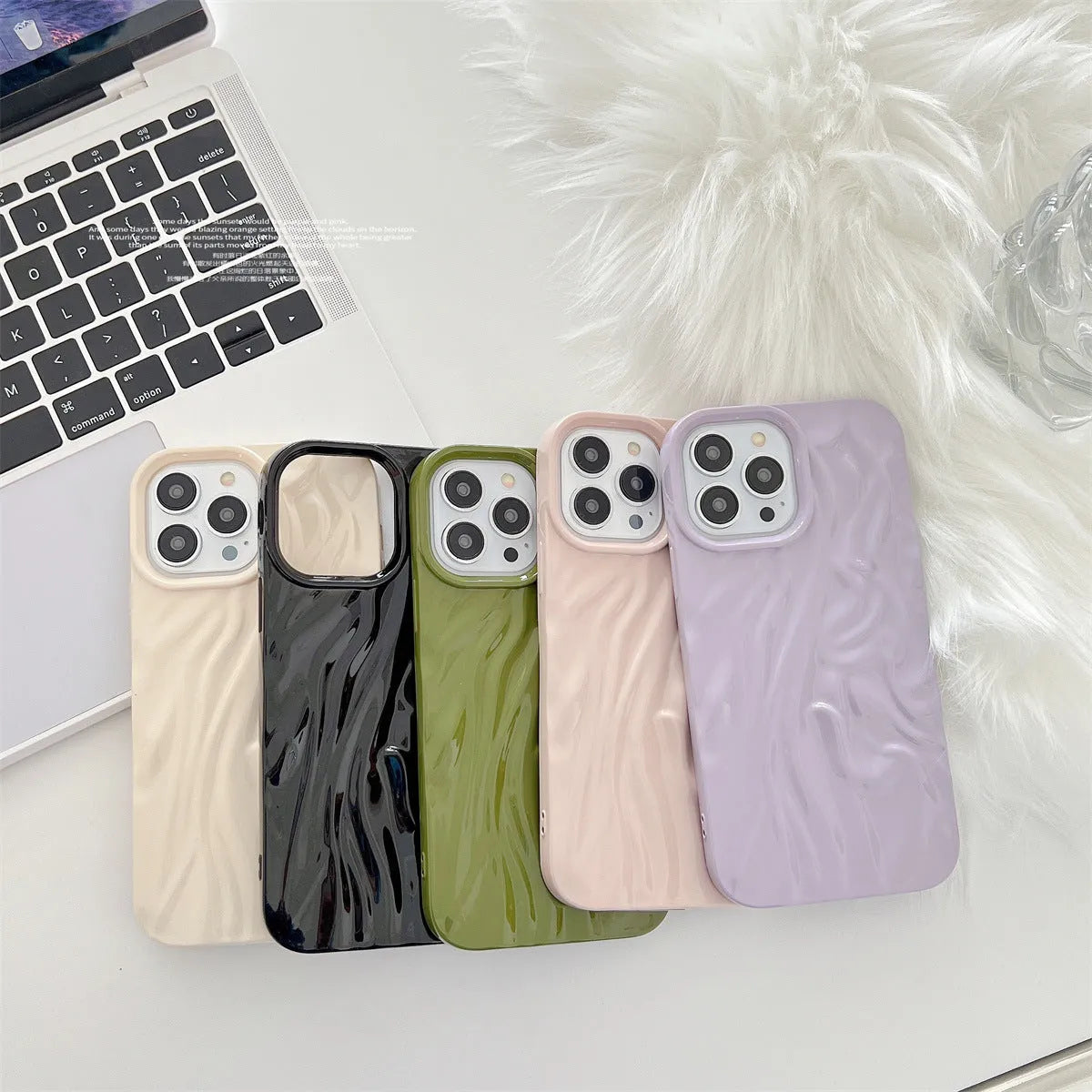 Solid colour water ripple texture silicone case for iPhone on a table.