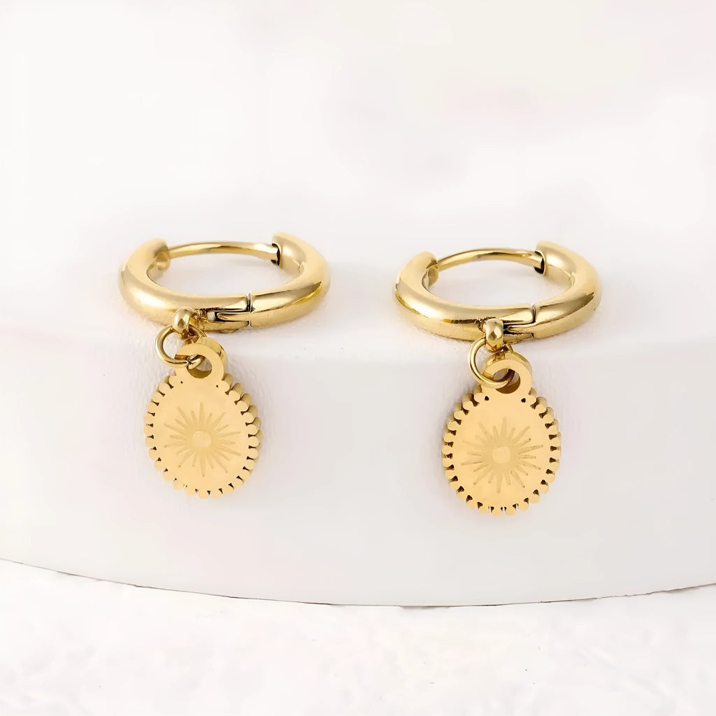 A pair of stainless steel geometric ellipse earrings in colour XY-EH005 on a white background.