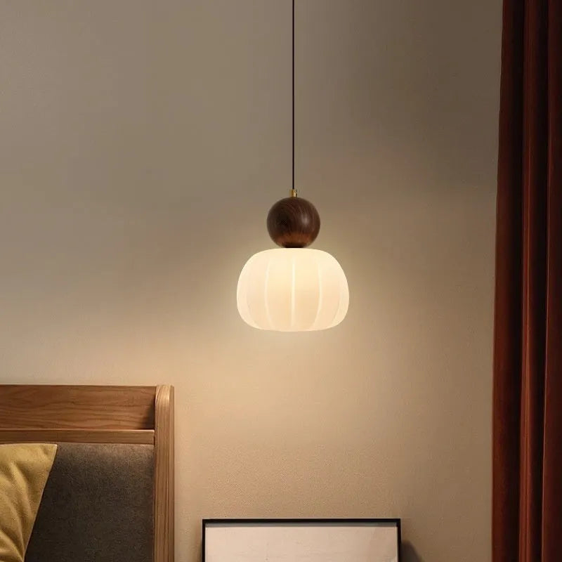 Creative alloy pumpkin chandelier light fixture for ceiling mounting in cream, red, green, chrome, or walnut finish.