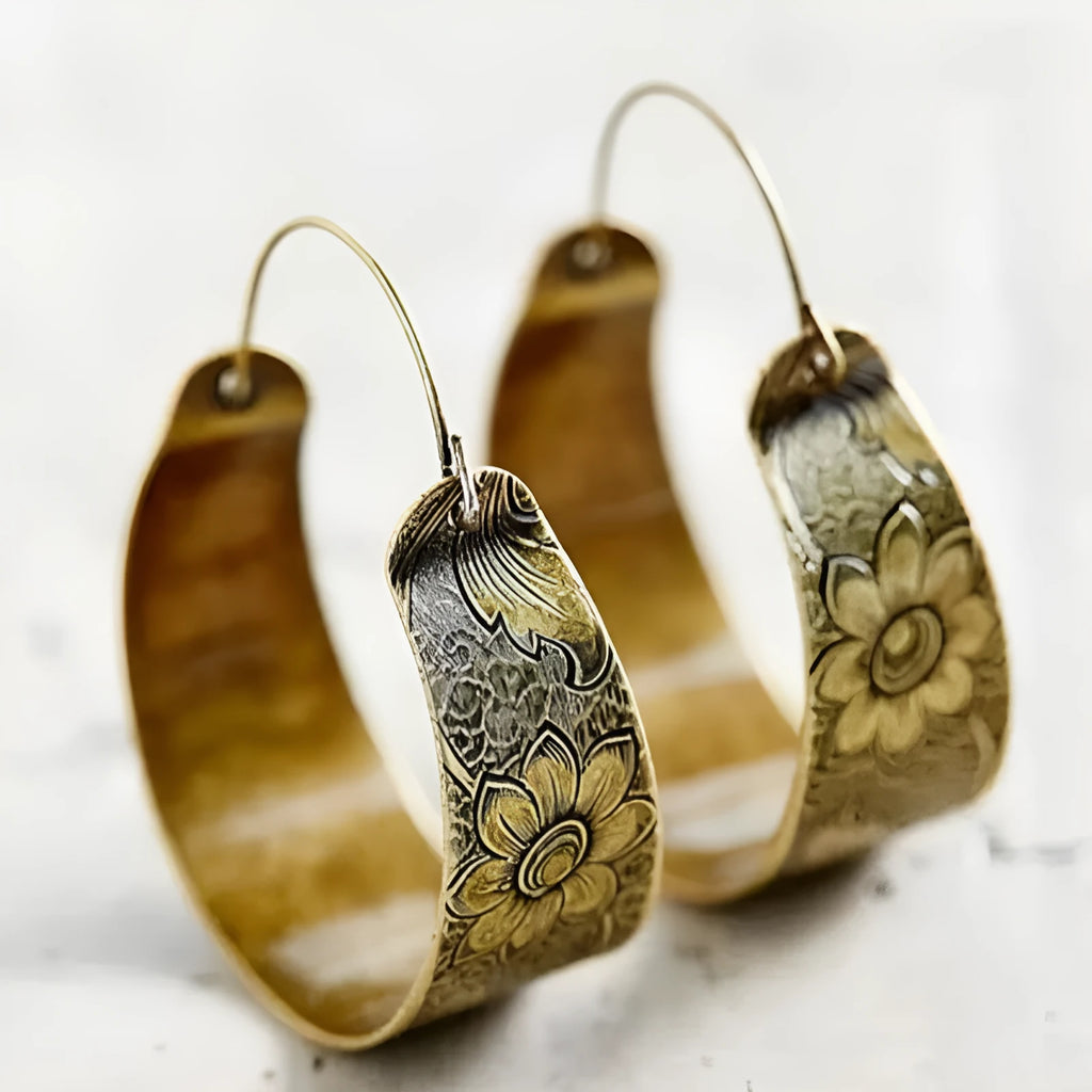 Gold geometric hollow pattern earrings with petal detailing on alloy construction