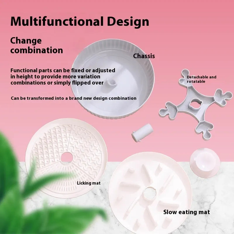 Grey slow feed dog bowl with rotating puzzle disc and a textured, green silicone licking mat in the centre