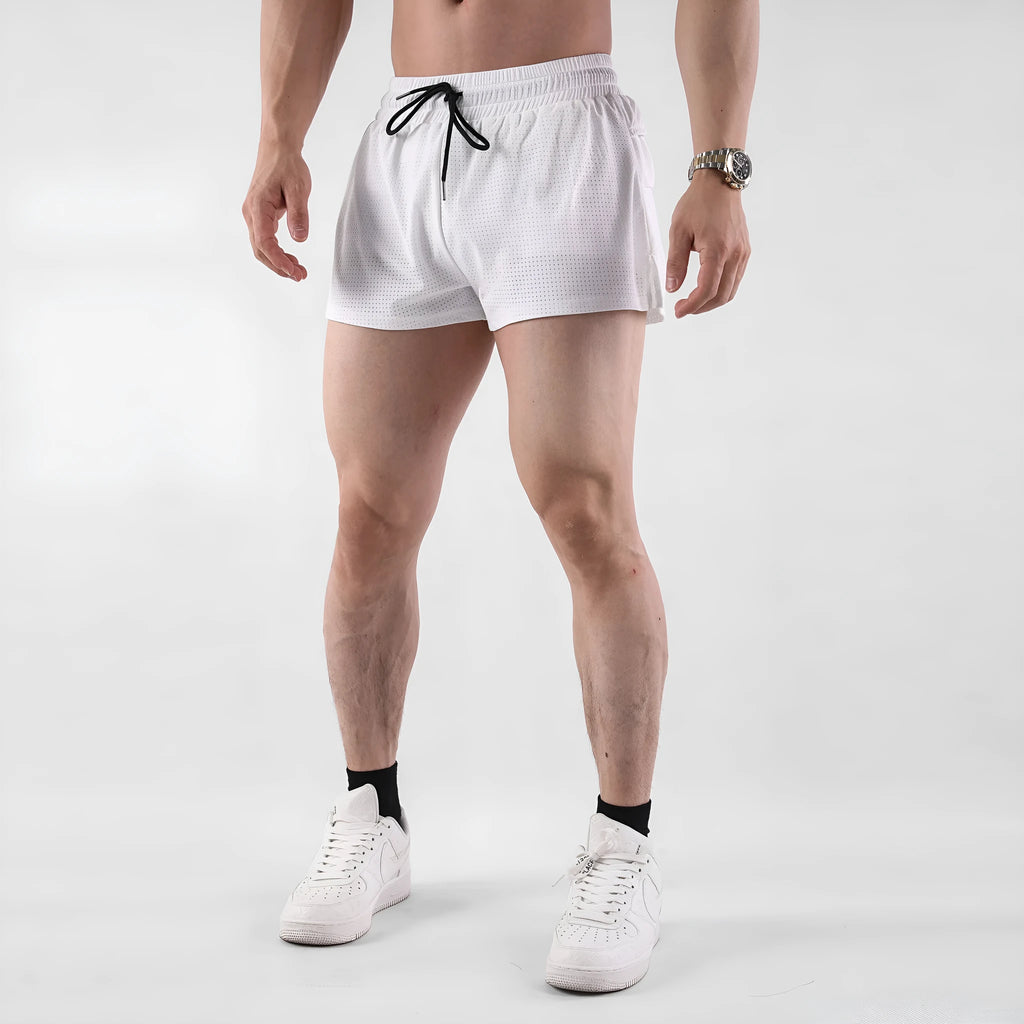 Men's black and white quick-drying nylon summer shorts laid flat, showing mid-waist and short length design.