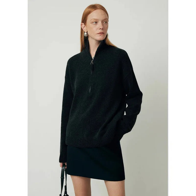 A woman's loose lapels bandage dress in wool, shown in black and grey, with long sleeves.