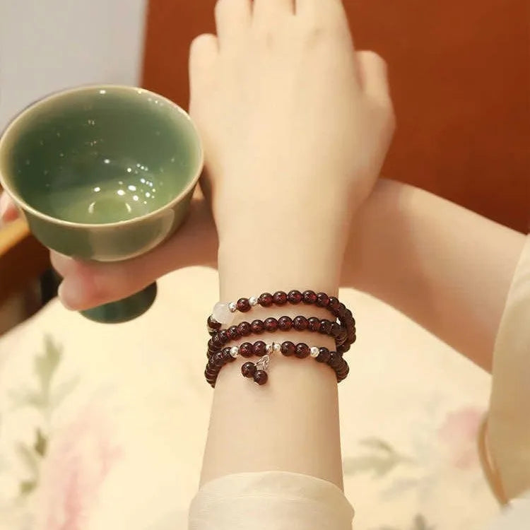Antique style Chinese bracelet with U-shaped design and floral red garnet imitation gemstones